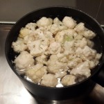 Boil cauliflower until soft and mash using a hand blender,