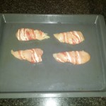 2.	Wrap the bacon around the chicken and place into oven (200 degree grill)