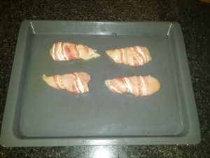 2.	Wrap the bacon around the chicken and place into oven (200 degree grill)