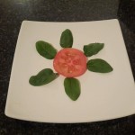 2.	Place the tomato with the leaves around