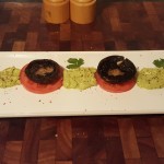 8.	When cooked, place the mushroom on top of the tomato;