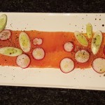 4.	Garnish the salmon with the leek and radish, dress with olive oil and salt and pepper