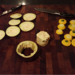 4.	Slice the patty pans into half, and aubergine into disks. Note the hollowed out ¼ length aubergine disk;