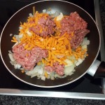 3.	Fry diced onion and garlic until onion is blonde, add the mince and carrots;