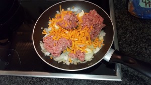 3.	Fry diced onion and garlic until onion is blonde, add the mince and carrots;