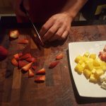 2.	Cut the feta, mango and strawberries into cubes, with some strawberries just into half
