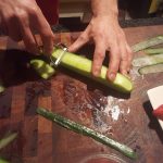3.	Using a potato peeler, peel slices of the cucumber the full length of the cucumber.