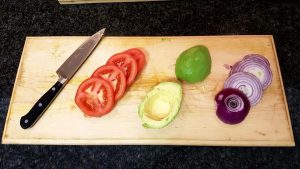 Lightly peel the skin off the avo (like the skin off an apple). Slice the onion and tomato