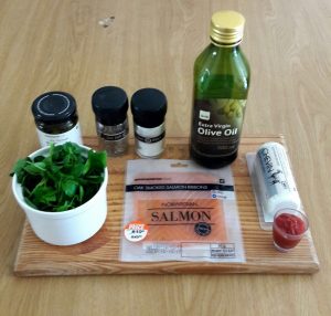 Ingredients: salmon, goats cheese, water cres, tomato sauce, garlic, pesto, salt, pepper and olive oil.