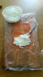 Spread the cheese on the salmon