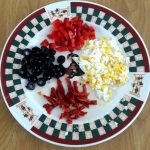 Chop the peppers, olives, eggs and sun dried tomato